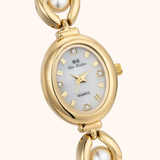 Perla - reloj dorado con detalles perlados
